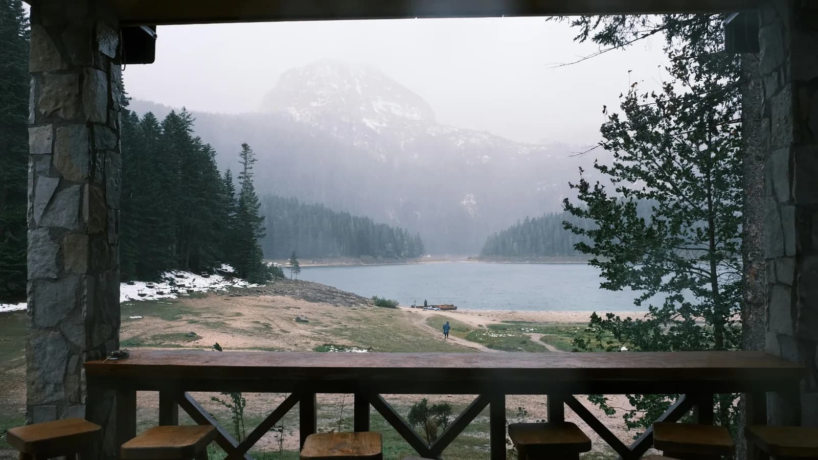 Lakeside cabin in bear country surrounded by forest